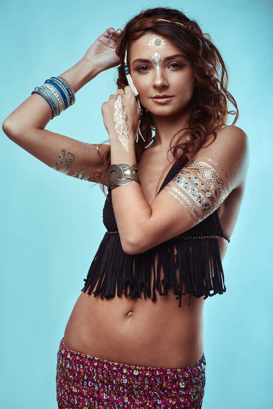 Woman in bohemian style accessories in warm light
